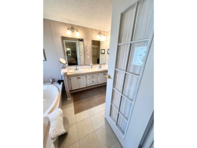If you're looking for a beautifully maintained, move-in-ready on Pine Lakes Country Club in Florida - for sale on GolfHomes.com, golf home, golf lot