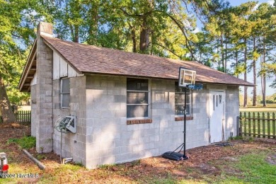 This spacious 3 bedroom 2 bath home showcases beautiful hardwood on Bayview Golf Course in North Carolina - for sale on GolfHomes.com, golf home, golf lot