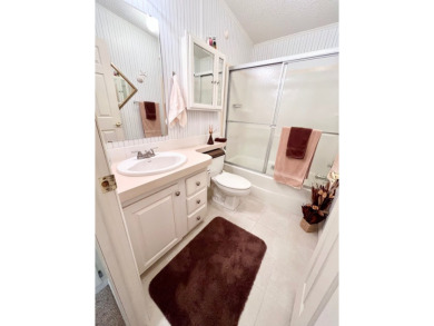 If you're looking for a beautifully maintained, move-in-ready on Pine Lakes Country Club in Florida - for sale on GolfHomes.com, golf home, golf lot
