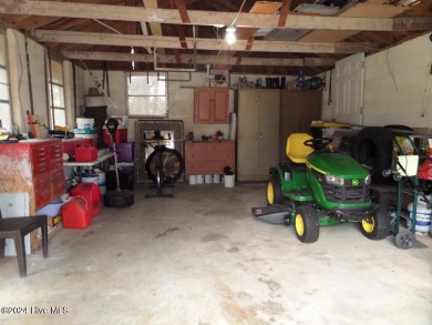 This spacious 3 bedroom 2 bath home showcases beautiful hardwood on Bayview Golf Course in North Carolina - for sale on GolfHomes.com, golf home, golf lot