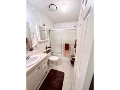 If you're looking for a beautifully maintained, move-in-ready on Pine Lakes Country Club in Florida - for sale on GolfHomes.com, golf home, golf lot