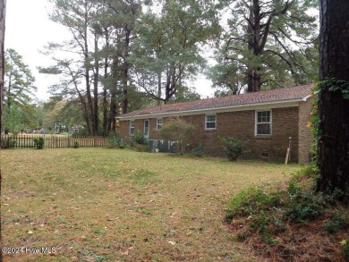 This spacious 3 bedroom 2 bath home showcases beautiful hardwood on Bayview Golf Course in North Carolina - for sale on GolfHomes.com, golf home, golf lot