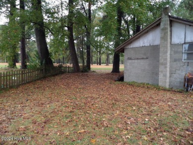 This spacious 3 bedroom 2 bath home showcases beautiful hardwood on Bayview Golf Course in North Carolina - for sale on GolfHomes.com, golf home, golf lot