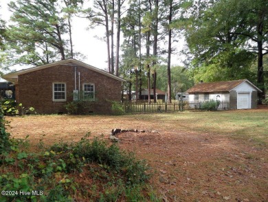 This spacious 3 bedroom 2 bath home showcases beautiful hardwood on Bayview Golf Course in North Carolina - for sale on GolfHomes.com, golf home, golf lot