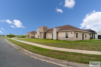 Beautiful resaca lot home located in the private La Hacienda at on Rancho Viejo Resort and Country Club in Texas - for sale on GolfHomes.com, golf home, golf lot