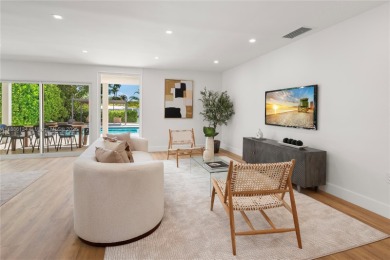 Exceptional fully renovated waterfront residence located on the on Normandy Shores Golf Course in Florida - for sale on GolfHomes.com, golf home, golf lot