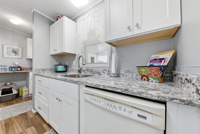 This Polo Park beauty features numerous recent updates on Polo Park Golf Course in Florida - for sale on GolfHomes.com, golf home, golf lot