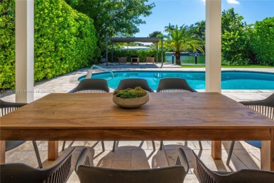 Exceptional fully renovated waterfront residence located on the on Normandy Shores Golf Course in Florida - for sale on GolfHomes.com, golf home, golf lot