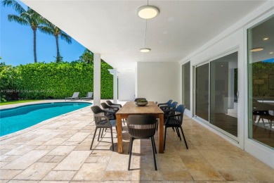 Exceptional fully renovated waterfront residence located on the on Normandy Shores Golf Course in Florida - for sale on GolfHomes.com, golf home, golf lot