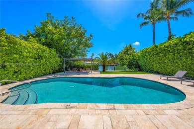 Exceptional fully renovated waterfront residence located on the on Normandy Shores Golf Course in Florida - for sale on GolfHomes.com, golf home, golf lot