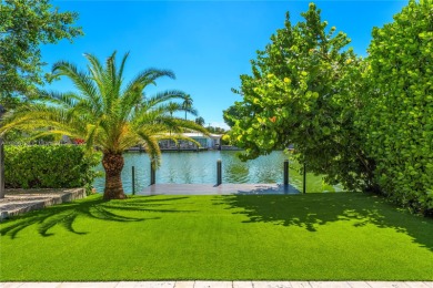 Exceptional fully renovated waterfront residence located on the on Normandy Shores Golf Course in Florida - for sale on GolfHomes.com, golf home, golf lot