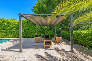 Exceptional fully renovated waterfront residence located on the on Normandy Shores Golf Course in Florida - for sale on GolfHomes.com, golf home, golf lot