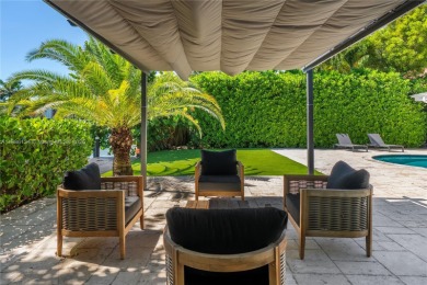 Exceptional fully renovated waterfront residence located on the on Normandy Shores Golf Course in Florida - for sale on GolfHomes.com, golf home, golf lot