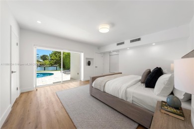 Exceptional fully renovated waterfront residence located on the on Normandy Shores Golf Course in Florida - for sale on GolfHomes.com, golf home, golf lot