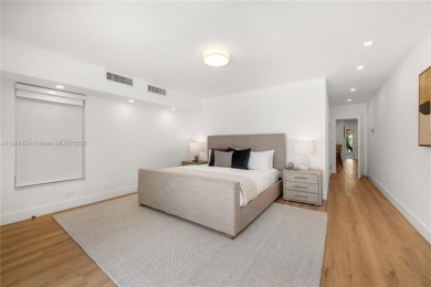 Exceptional fully renovated waterfront residence located on the on Normandy Shores Golf Course in Florida - for sale on GolfHomes.com, golf home, golf lot