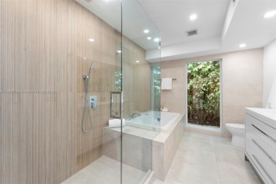 Exceptional fully renovated waterfront residence located on the on Normandy Shores Golf Course in Florida - for sale on GolfHomes.com, golf home, golf lot