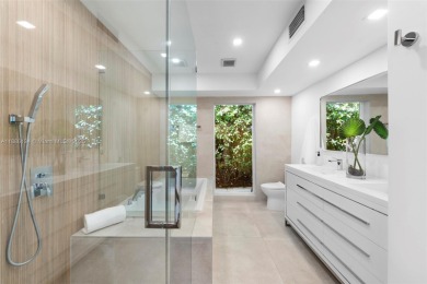 Exceptional fully renovated waterfront residence located on the on Normandy Shores Golf Course in Florida - for sale on GolfHomes.com, golf home, golf lot