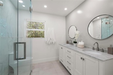 Exceptional fully renovated waterfront residence located on the on Normandy Shores Golf Course in Florida - for sale on GolfHomes.com, golf home, golf lot