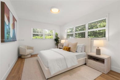 Exceptional fully renovated waterfront residence located on the on Normandy Shores Golf Course in Florida - for sale on GolfHomes.com, golf home, golf lot