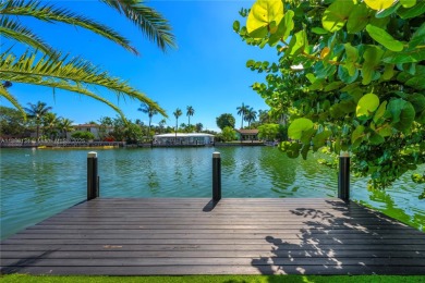Exceptional fully renovated waterfront residence located on the on Normandy Shores Golf Course in Florida - for sale on GolfHomes.com, golf home, golf lot