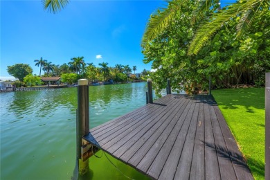 Exceptional fully renovated waterfront residence located on the on Normandy Shores Golf Course in Florida - for sale on GolfHomes.com, golf home, golf lot
