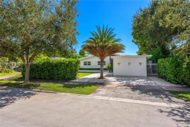 Exceptional fully renovated waterfront residence located on the on Normandy Shores Golf Course in Florida - for sale on GolfHomes.com, golf home, golf lot