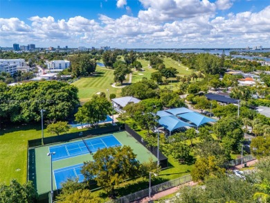 Exceptional fully renovated waterfront residence located on the on Normandy Shores Golf Course in Florida - for sale on GolfHomes.com, golf home, golf lot