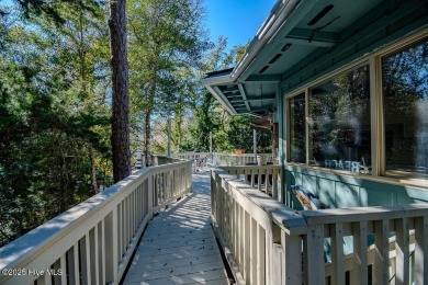 Nestled in the picturesque Pine Knoll Shores of North Carolina on The Country Club of the Crystal Coast in North Carolina - for sale on GolfHomes.com, golf home, golf lot