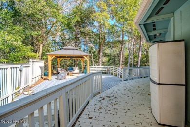 Nestled in the picturesque Pine Knoll Shores of North Carolina on The Country Club of the Crystal Coast in North Carolina - for sale on GolfHomes.com, golf home, golf lot