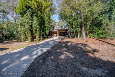 Nestled in the picturesque Pine Knoll Shores of North Carolina on The Country Club of the Crystal Coast in North Carolina - for sale on GolfHomes.com, golf home, golf lot