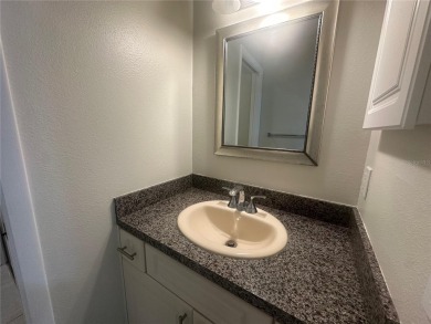 This 55 and over  2 bedroom 2 bath 1129 sq ft condo is located on Beacon Woods Golf Club in Florida - for sale on GolfHomes.com, golf home, golf lot
