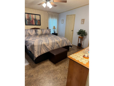 This well-maintained 2-bedroom, 2-bath home offers 1,255 sq. ft on Golden Lakes Golf Course in Florida - for sale on GolfHomes.com, golf home, golf lot
