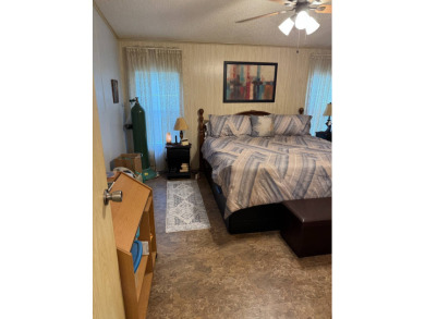 This well-maintained 2-bedroom, 2-bath home offers 1,255 sq. ft on Golden Lakes Golf Course in Florida - for sale on GolfHomes.com, golf home, golf lot