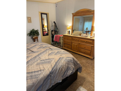 This well-maintained 2-bedroom, 2-bath home offers 1,255 sq. ft on Golden Lakes Golf Course in Florida - for sale on GolfHomes.com, golf home, golf lot