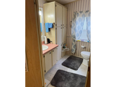 This well-maintained 2-bedroom, 2-bath home offers 1,255 sq. ft on Golden Lakes Golf Course in Florida - for sale on GolfHomes.com, golf home, golf lot