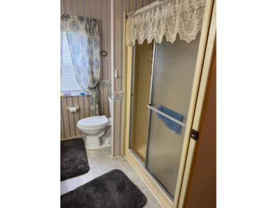 This well-maintained 2-bedroom, 2-bath home offers 1,255 sq. ft on Golden Lakes Golf Course in Florida - for sale on GolfHomes.com, golf home, golf lot