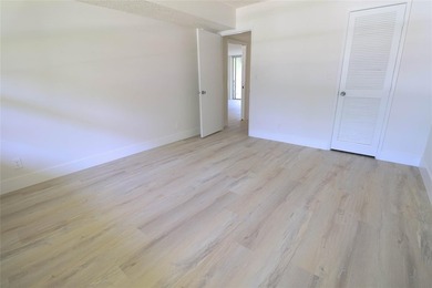 Take a look at this beautiful condo in Palm Aire with new floors on Palm-Aire Country Club and Resort - Palms in Florida - for sale on GolfHomes.com, golf home, golf lot