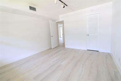 Take a look at this beautiful condo in Palm Aire with new floors on Palm-Aire Country Club and Resort - Palms in Florida - for sale on GolfHomes.com, golf home, golf lot