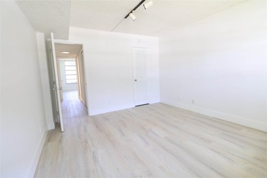 Take a look at this beautiful condo in Palm Aire with new floors on Palm-Aire Country Club and Resort - Palms in Florida - for sale on GolfHomes.com, golf home, golf lot