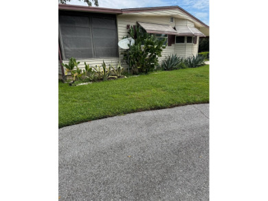 This well-maintained 2-bedroom, 2-bath home offers 1,255 sq. ft on Golden Lakes Golf Course in Florida - for sale on GolfHomes.com, golf home, golf lot