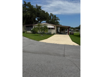 This well-maintained 2-bedroom, 2-bath home offers 1,255 sq. ft on Golden Lakes Golf Course in Florida - for sale on GolfHomes.com, golf home, golf lot