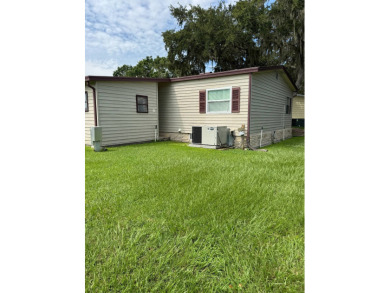 This well-maintained 2-bedroom, 2-bath home offers 1,255 sq. ft on Golden Lakes Golf Course in Florida - for sale on GolfHomes.com, golf home, golf lot