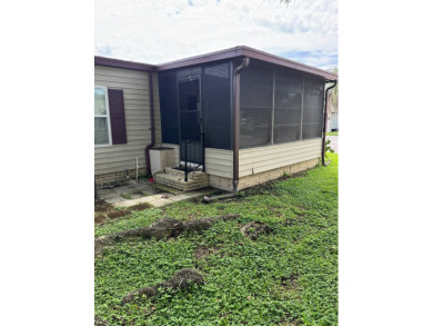 This well-maintained 2-bedroom, 2-bath home offers 1,255 sq. ft on Golden Lakes Golf Course in Florida - for sale on GolfHomes.com, golf home, golf lot