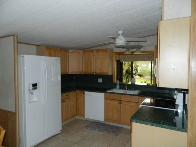 Lovely oasis in backyard, this 1,467 sq ft home on a perimeter on Grasslands Golf and Country Club in Florida - for sale on GolfHomes.com, golf home, golf lot