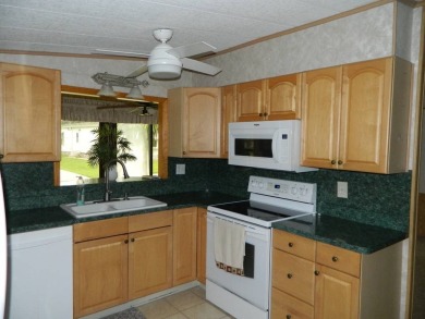 Lovely oasis in backyard, this 1,467 sq ft home on a perimeter on Grasslands Golf and Country Club in Florida - for sale on GolfHomes.com, golf home, golf lot