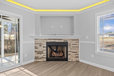 The Ridge plan! The primary suite, laundry, and living area fill on Woodfin Ridge Golf Club in South Carolina - for sale on GolfHomes.com, golf home, golf lot