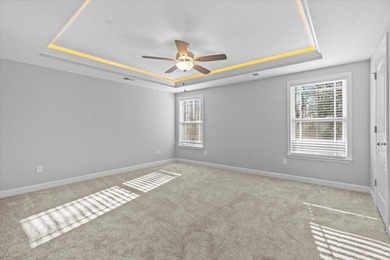 The Ridge plan! The primary suite, laundry, and living area fill on Woodfin Ridge Golf Club in South Carolina - for sale on GolfHomes.com, golf home, golf lot