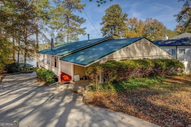 Panoramic big water views from this charming DEEDED lakefront on Turtle Cove Golf Course in Georgia - for sale on GolfHomes.com, golf home, golf lot