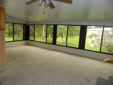 Lovely oasis in backyard, this 1,467 sq ft home on a perimeter on Grasslands Golf and Country Club in Florida - for sale on GolfHomes.com, golf home, golf lot