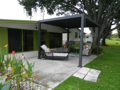 Lovely oasis in backyard, this 1,467 sq ft home on a perimeter on Grasslands Golf and Country Club in Florida - for sale on GolfHomes.com, golf home, golf lot